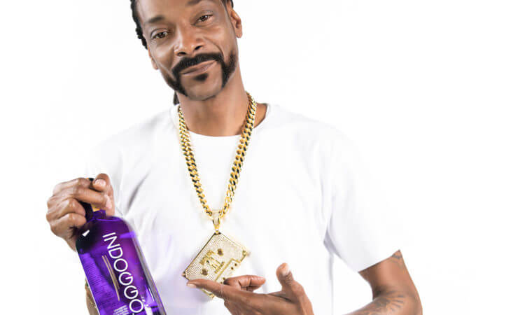 Snoop with an INDOGGO GIn Bottle