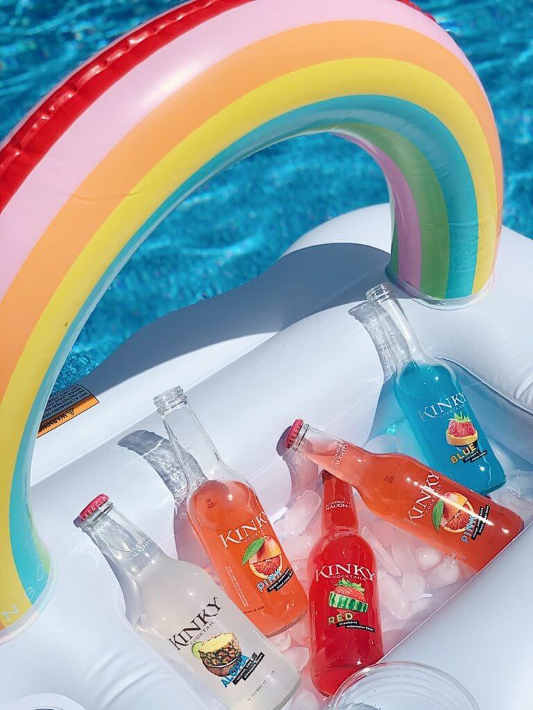 Kinky Family single serve drinks in an ice cooler in the sun
