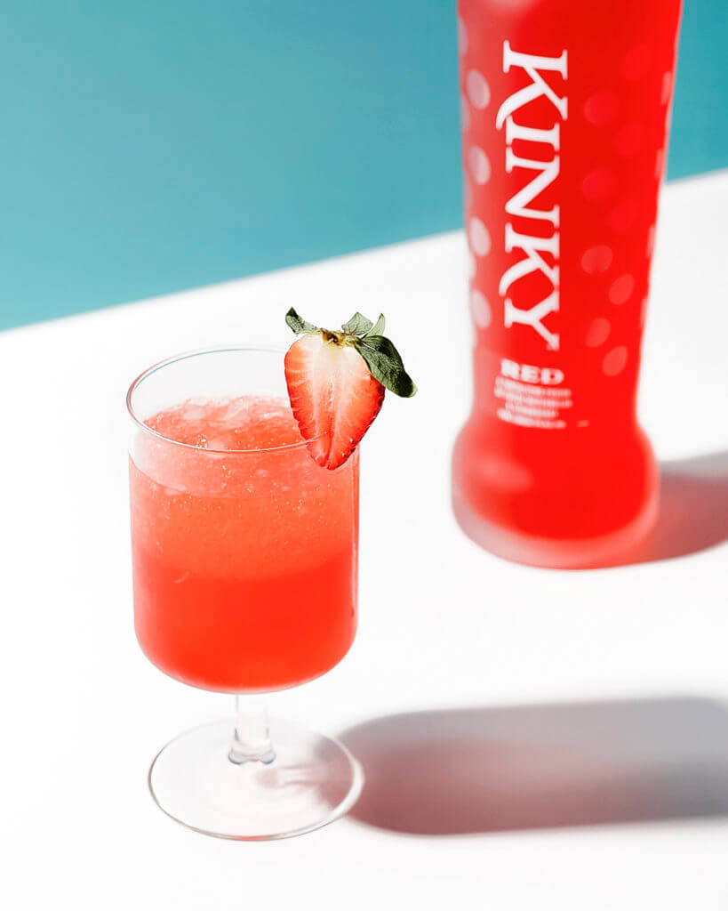 kinky-red-rita and a kinky red bottle