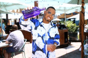 Terrence J Shows Off a Bottle of his Favorite Gin INDOGGO