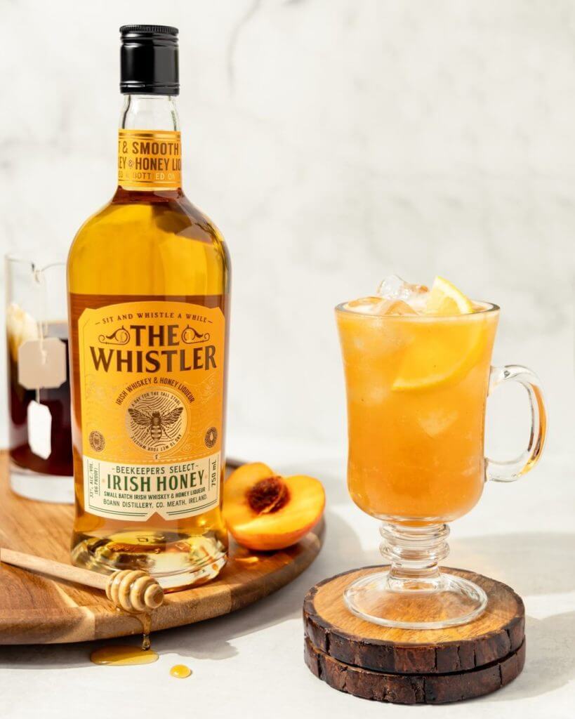 The whistler irish honey Bottle with a drink