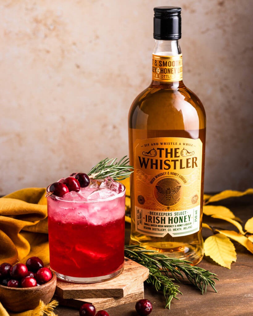 Cranberry Spritz cocktail with the whistler bottle on the side