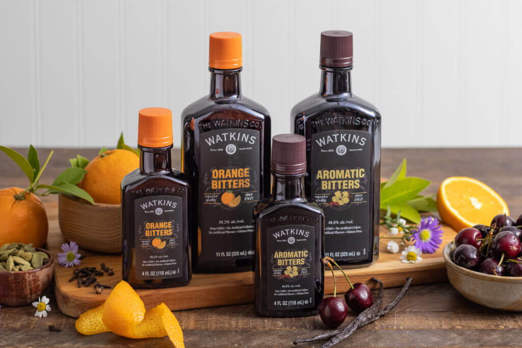 Watkins Header Image - 4 bottles of watkins with a couple tastes - Orange Bitters and Aromatic Bitters
