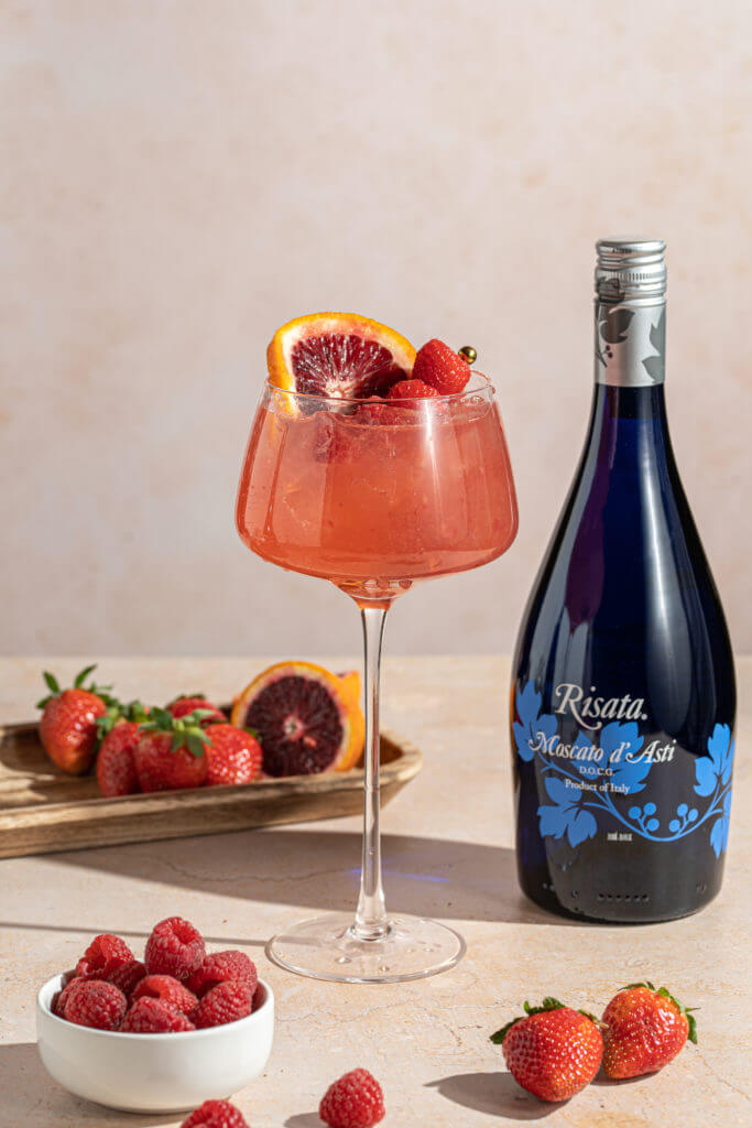 Risata - Berry Punch and a bottle of Risata Moscato d'Asti beside it